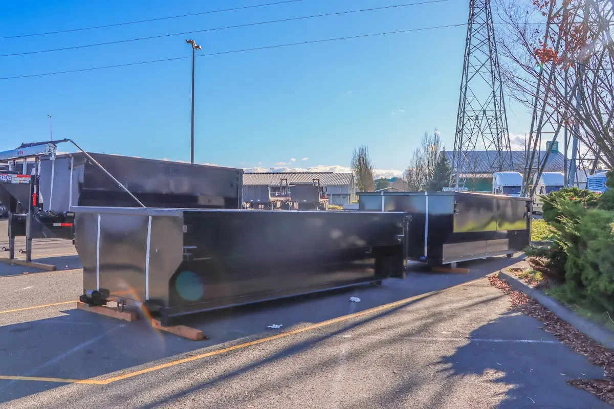 Roll-off dumpster ready for waste disposal at job site for Yard Waste Dumpster Rental in Smithfield